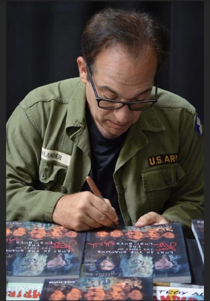 Lost in the Shadows: The Making of the Lost Boys in stock at ready to ship from the UK at TheMovieMerch.com - Jamison Newlander signing